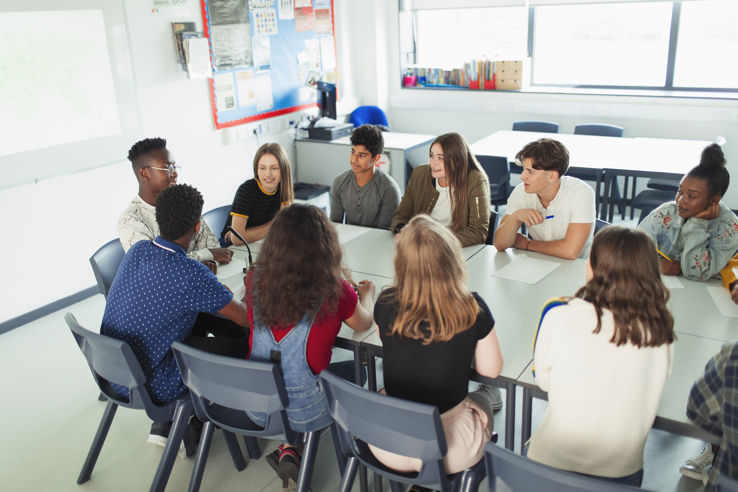 THE COMMUNITY INVESTMENT GUARANTEE POOL (CIGP) — student group gathered around table